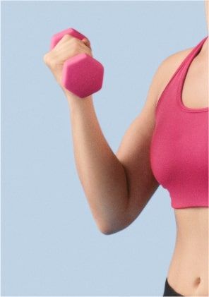 A sportswoman holds a dumbbell